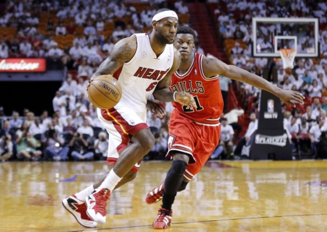 Miami Heat's LeBron James (L) drives past Chicago Bulls' Jimmy Butler during Game 2 of their NBA Eastern Conference semi-final basketball playoff in Miami, Florida May 8, 2013. REUTERS/Joe Skipper 