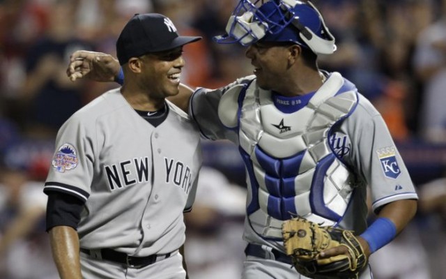 American League catcher Salvador Perez of the Kansas City Royals hugs New York Yankees pitcher Mariano Rivera (L) after Rivera pitched the eighth inning against the National League during Major League Baseball's All-Star Game in New York, July 16, 2013. REUTERS/Shannon Stapleton 