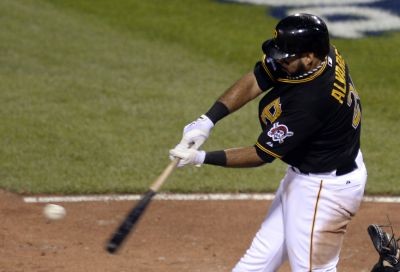  Pedro Alvarez (24) hits a RBI single against the St. Louis Cardinals during the 8th inning in game three of the National League divisional series playoff baseball game at PNC Park. Credit: H.Darr Beiser-USA TODAY Sports 