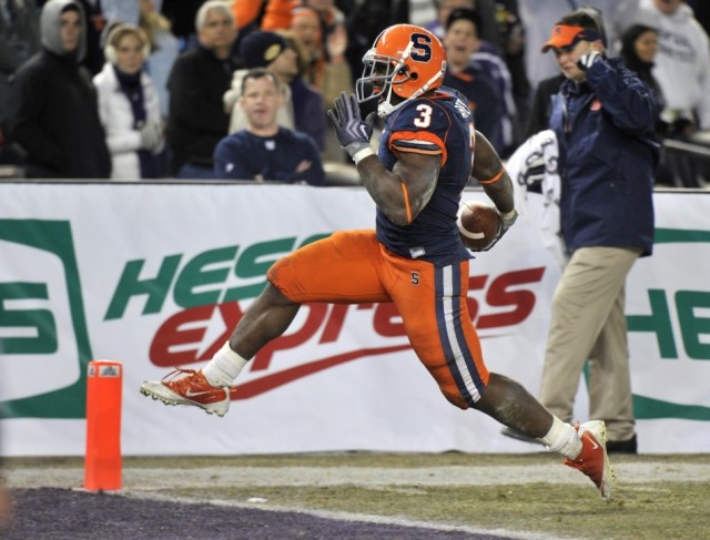 Former Syracuse RB Delone Carter reaches the end zone during the first ever New Era Pinstripe Bowl in December, 2010.  Carter enjoyed rushing success at Syracuse, thanks in part to the blocking of FB Adam Harris.  Carter is now an Indianapolis Colt.  (Photo: Reuters/Ray Stubblebine) 