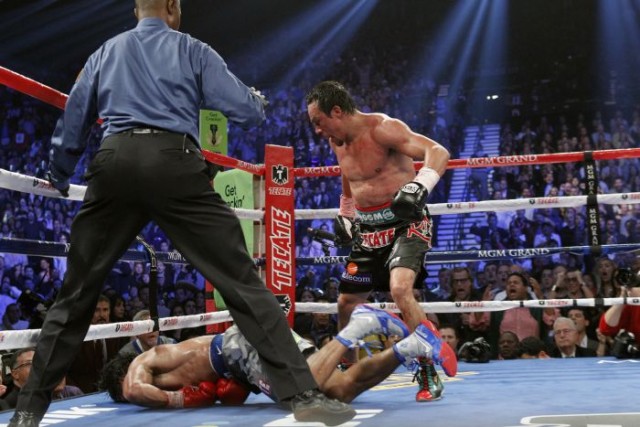 Pacquiao on the canvas after Marquez lands hard right overhand.