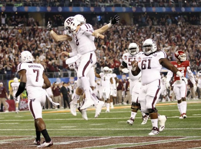 Texas A&M quarterback Manziel celebrates his touchdown with wide receiver Swope during the first half of the Cotton Bowl Classic NCAA football game against the University of Oklahoma in Arlington, Texas Mike Stone/Reuters 