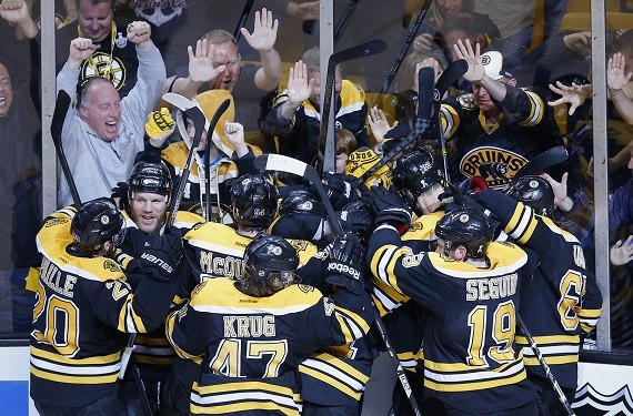 The Boston Bruins celebrate the win over the Pittsburgh Penguins in double overtime in Game 3 