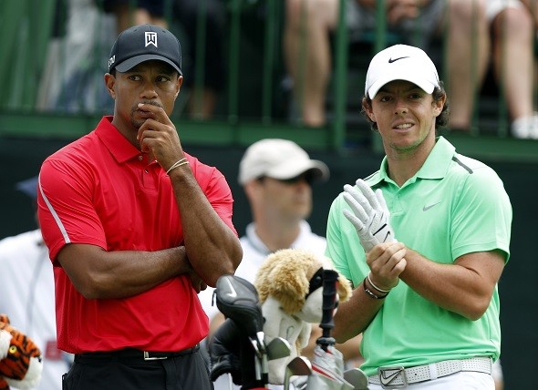 Tiger Woods of the U.S. talks to Rory McIlroy 