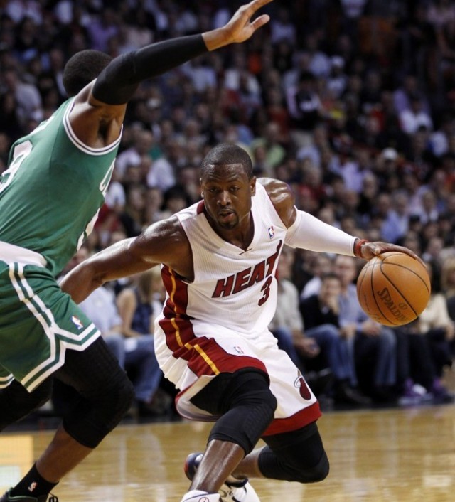 Dwayne Wade looks for an opening against Rajon Rondo