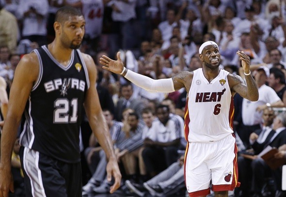 Miami Heat's LeBron James reacts during the fourth quarter as San Antonio Spurs' Tim Duncan