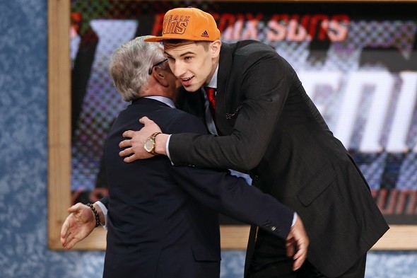 Alex Len from the University of Maryland hugs NBA Commissioner David Stern 