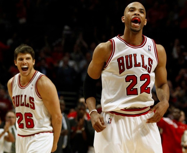 Chicago Bulls' Taj Gibson (R) and Kyle Korver celebrate a basket