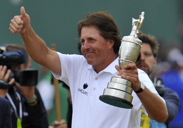 Phil Mickelson of the U.S. celebrates as he holds the Claret Jug 