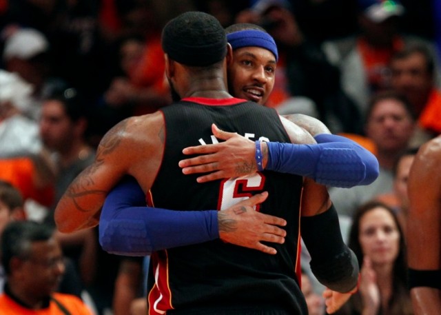 New York Knicks' Carmelo Anthony (back) embraces Miami Heat's LeBron James