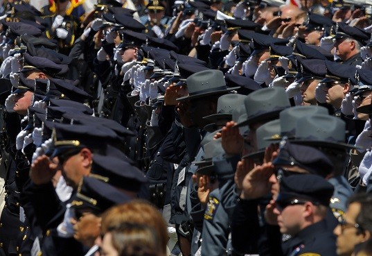 Thousands of police officers attend the memorial service for Massachusetts Institute of Technology 