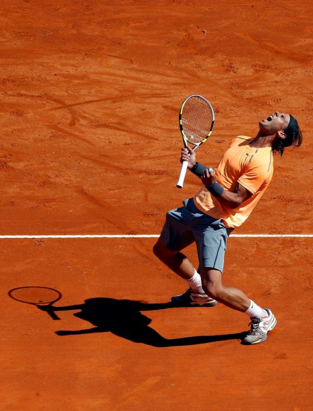 Rafael Nadal of Spain celebrates after defeating Novak Djokovic of Serbia 