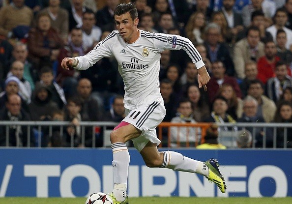 Real Madrid's Gareth Bale runs with the ball during his Champions League
