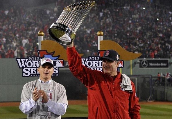Boston Red Sox manager John Farrell hoists the World Series championship trophy