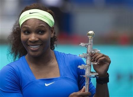 Serena Williams of the U.S. poses with the Ion Tiriac trophy