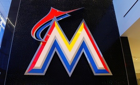 The neon logo of Miami Marlins in Diamond Club at Marlins Park is shown during a tour in Miami