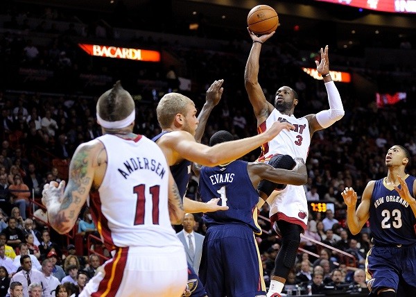 Miami Heat shooting guard Dwyane Wade and  New Orleans Pelicans point guard Tyreke Evans