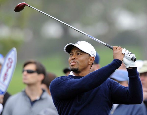 Tiger Woods tees off on the twelfth hole