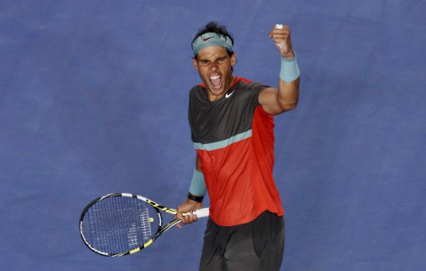 Rafael Nadal of Spain celebrates defeating Roger Federer 