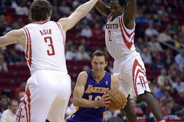 Los Angeles Lakers point guard Steve Nash and Houston Rockets center Omer Asik