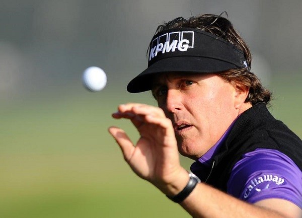Phil Mickelson warms