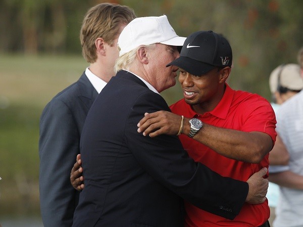Donald Trump talks with Tiger Woods