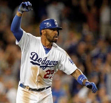 Los Angeles Dodgers' Matt Kemp celebrates after hitting the game-winning home run against Washington Nationals during the tenth inning of their MLB National League baseball game in Los Angeles