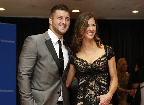 Football player Tim Tebow and guest arrive