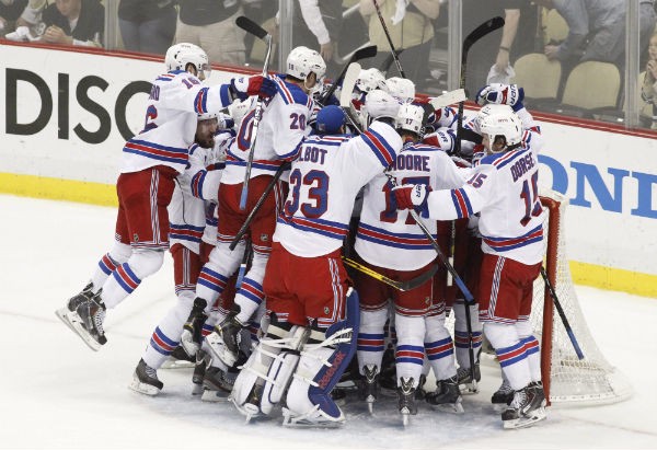 The New York Rangers celebrate after defeating the Pittsburgh Penguins