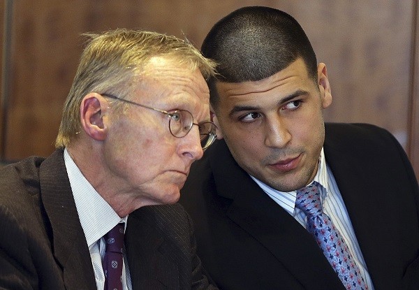 Aaron Hernandez (R) chats with his lawyer Charles Rankin 