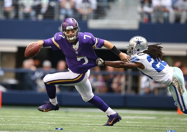 Minnesota Vikings running back Adrian Peterson blocks for Minnesota Vikings quarterback Christian Ponder