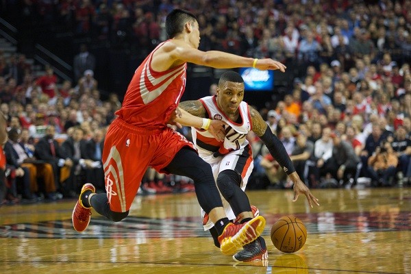 Houston Rockets guard Jeremy Lin (7) and center Omer Asik 