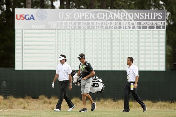 Bubba Watson (left) walks with his caddy Ted Scott as