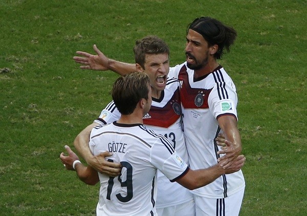 Germany's Thomas Mueller celebrates with Mario Goetze