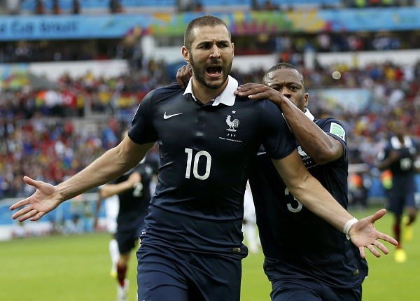 France's Patrice Evra celebrates with France's Karim Benzema 