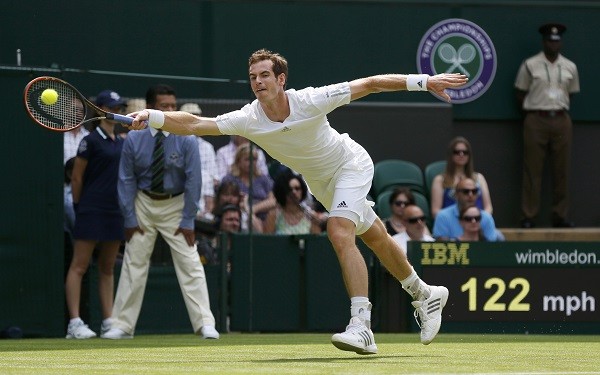Andy Murray of Britain hits a return to David Goffin