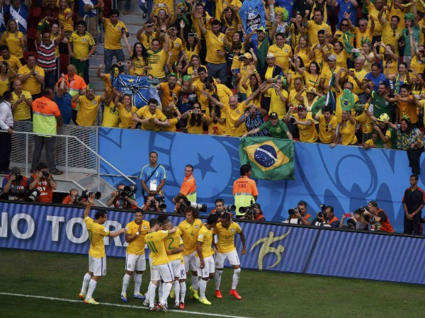 Brazil's Neymar is embraced