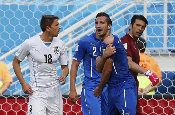 Italy's Giorgio Chiellini (3) complains to referee Marco Rodriguez