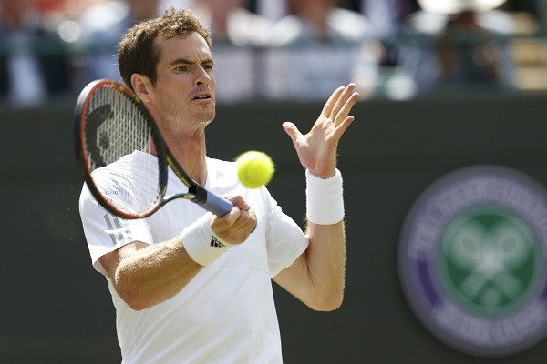 Andy Murray of Britain hits a return to Blaz Rola 