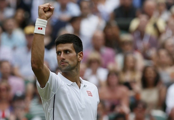 Novak Djokovic of Serbia celebrates his victory against Gilles Simon 