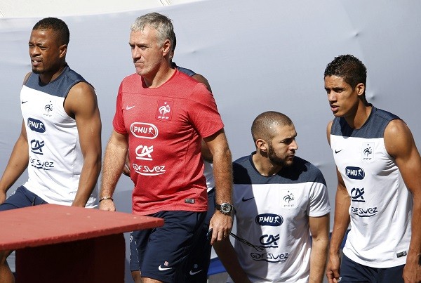 France's national soccer team players (L-R) Patrice Evra, Karim Benzema and Raphael Varane