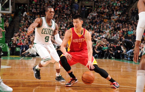 Jeremy Lin #7 of the Houston Rockets drives against Rajon Rondo #9 