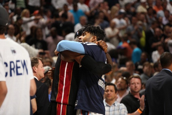 LeBron James #6 of the Miami Heat hugs Chris Douglas-Roberts #55