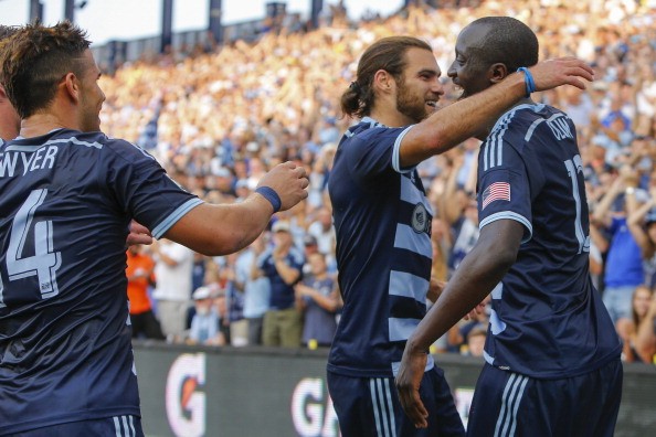 Lawrence Olum #13 celebrates with Graham Zusi #8 of Sporting KC after Olum 