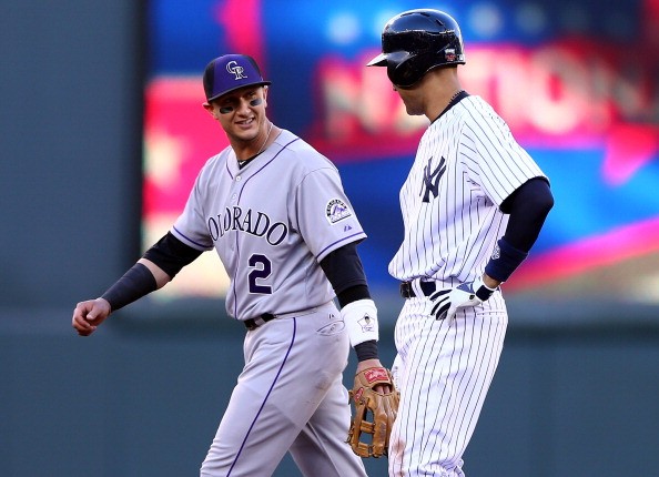 American League All-Star Derek Jeter #2 of the New York Yankees speaks with National League All-Star Troy Tulowitzki #2