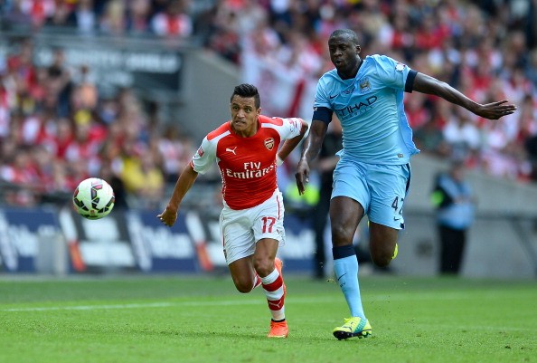 Alexis Sanchez of Arsenal and Yaya Toure of Manchester City 