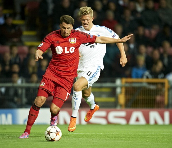 Sebastian Boenisch of Bayer Leverkusen and Andreas Cornelius of FC Copenhagen