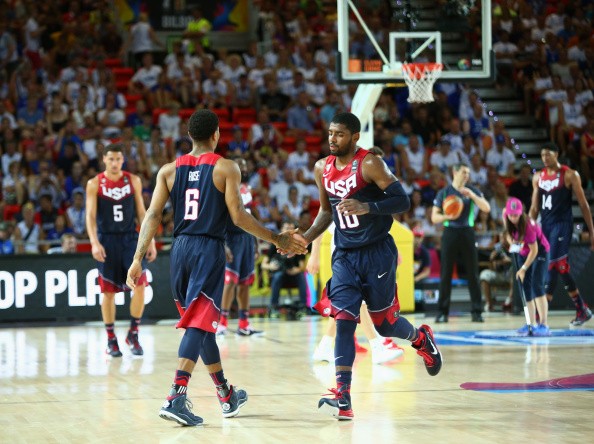 Teammates Derrick Rose #6 and Kyrie Irving #10