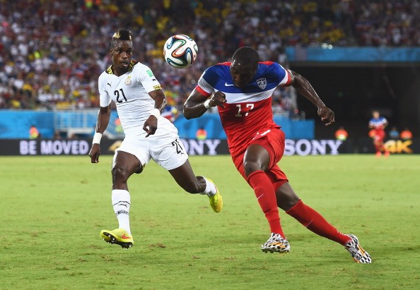 Jozy Altidore of the United States is chased by John Boye of Ghana 