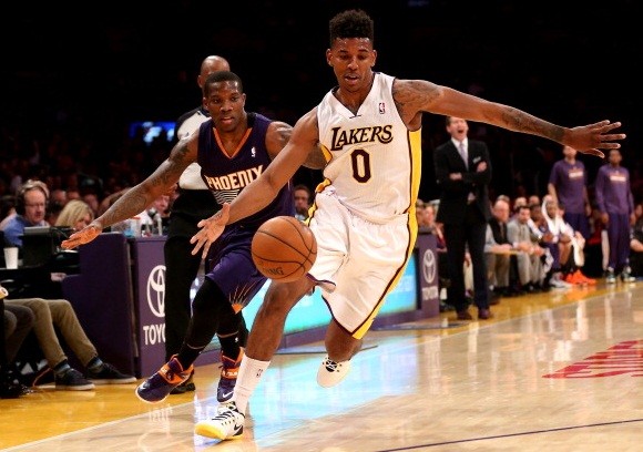 Nick Young #0 of the Los Angeles Lakers drives past Eric Bledsoe #2 of the Phoenix Suns